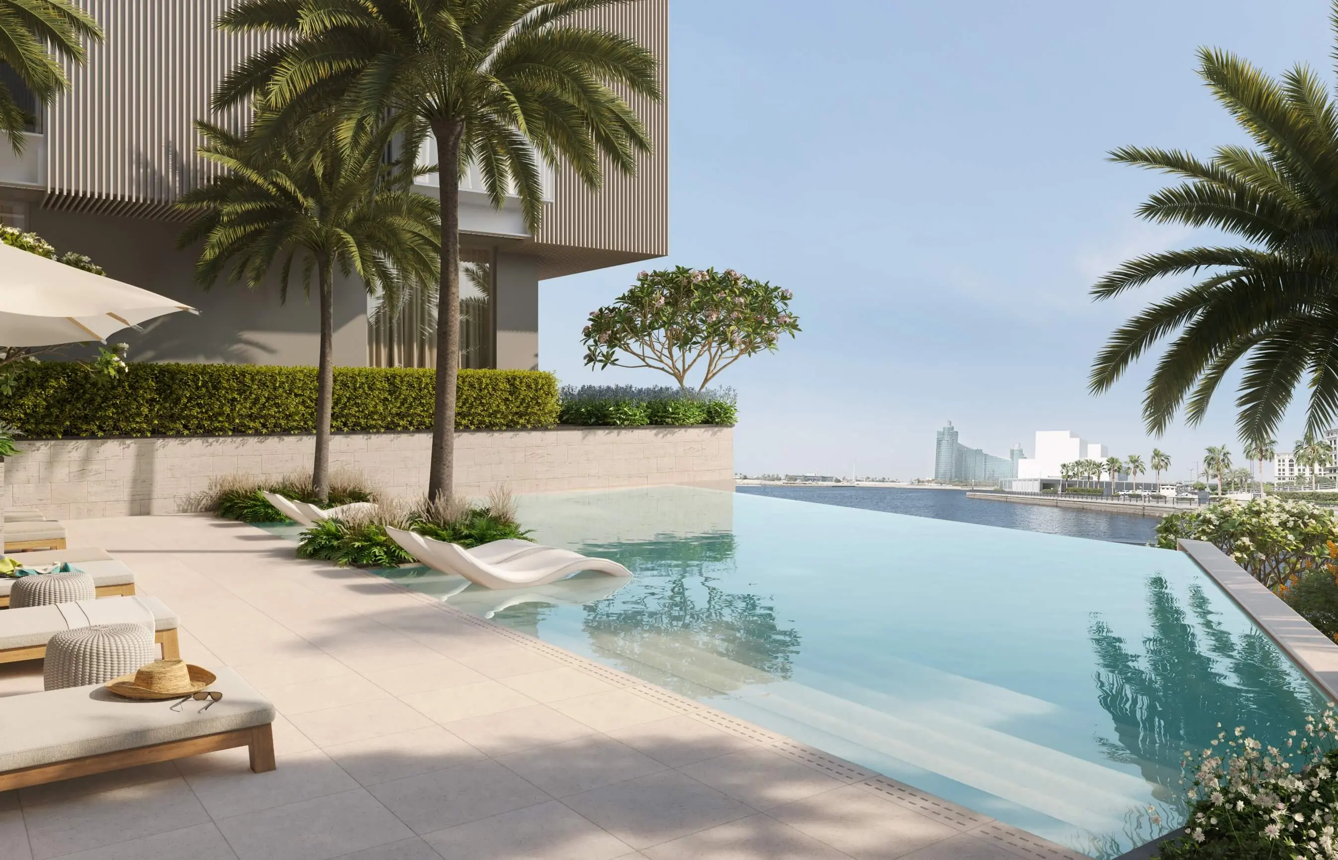 Render of the pool terrace, with in-water loungers on a shallow ledge, palms and Dubai Creek beyond the pool's edge
