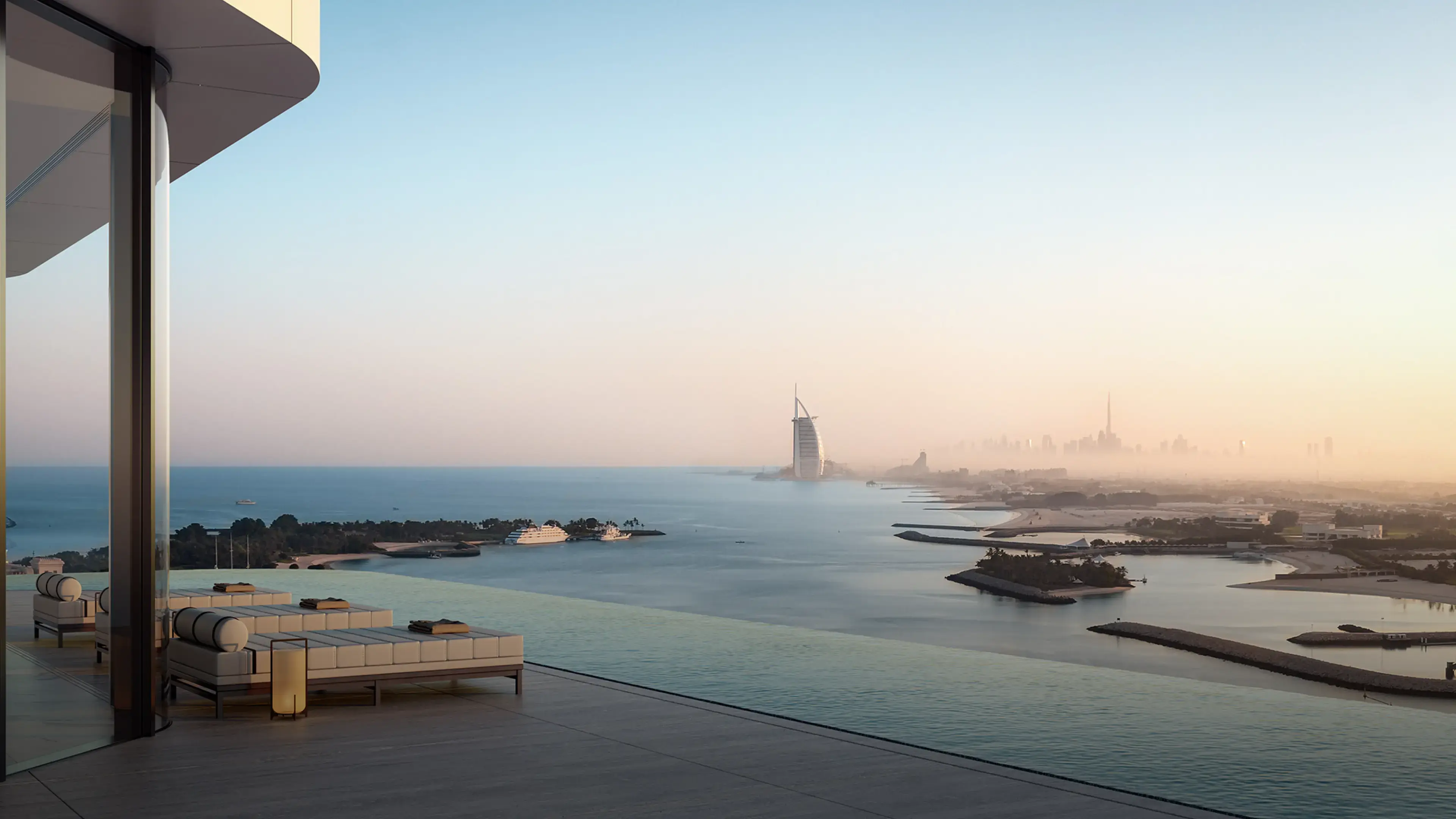 Render of day beds on a terrace beside an infinity edge, looking across the sea to the Burj Al Arab, with Burj Khalifa in the haze