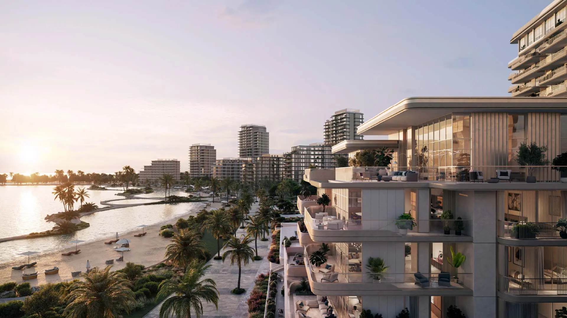 Render at sunset of terraces stepping along a building, above a palm-lined promenade, a beach and a curving lagoon