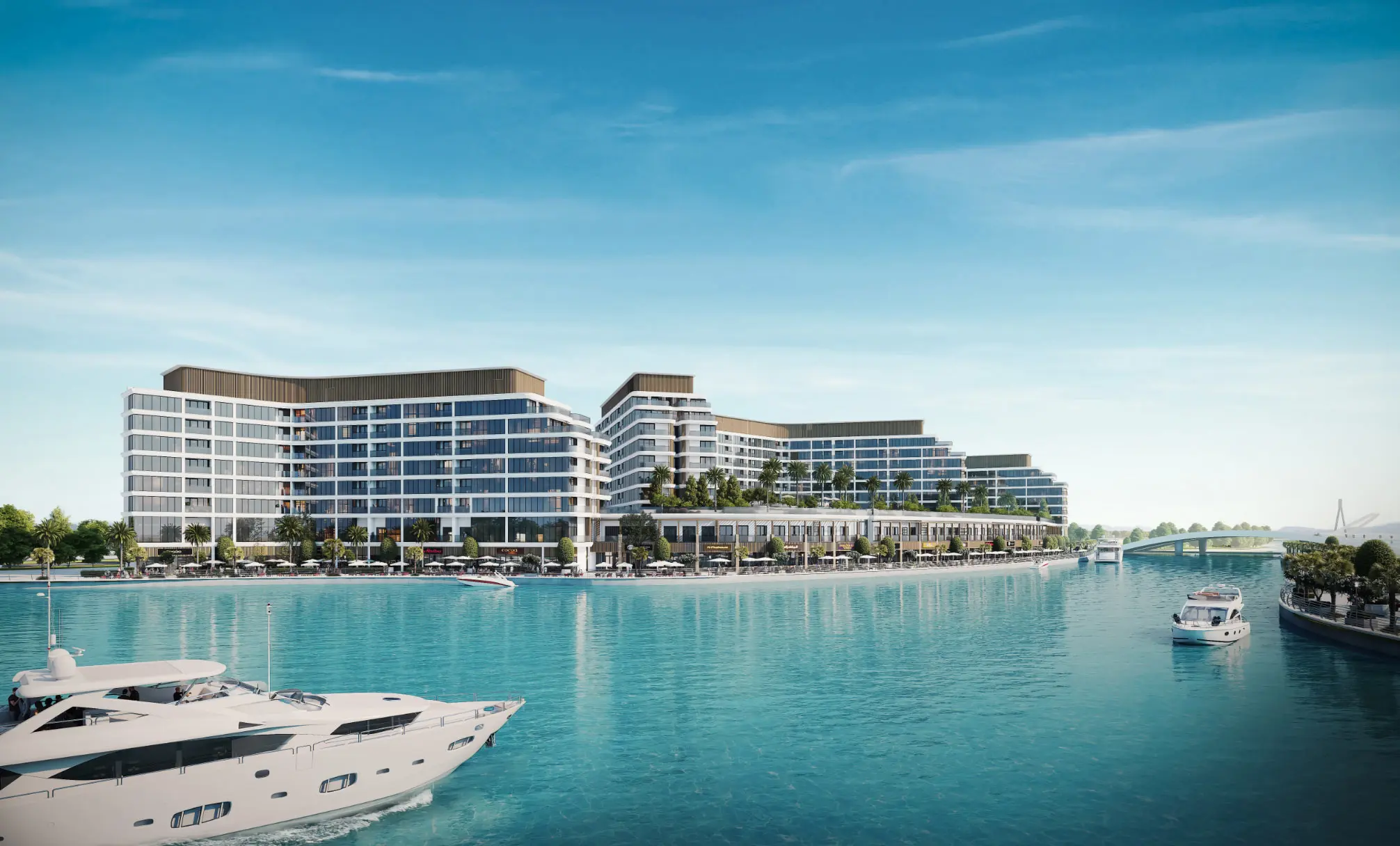 Render of long white apartment blocks along the marina edge, with a large yacht in front and an arched bridge on the right