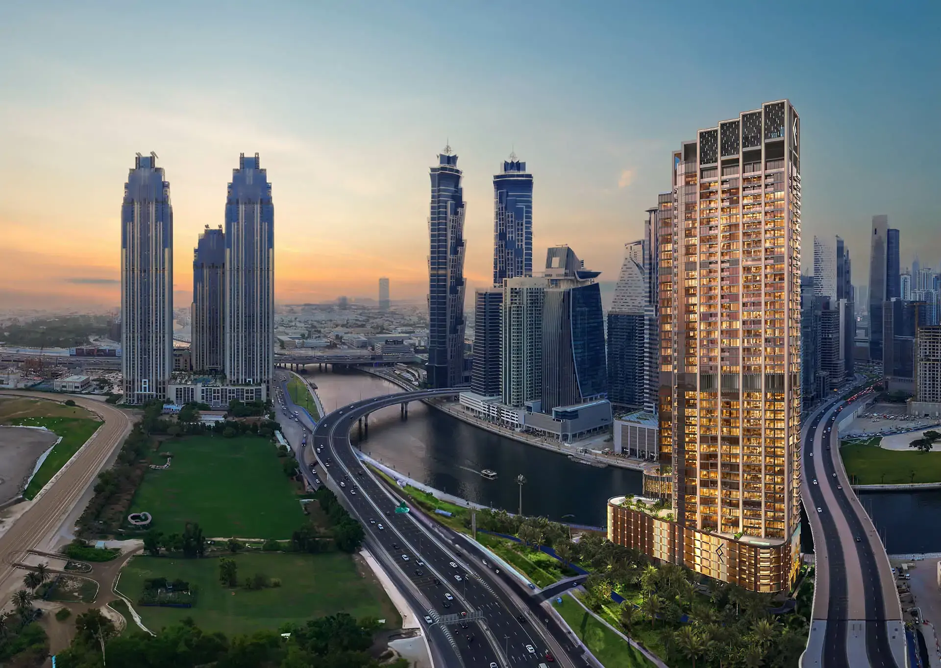 Ellington's render of One River Point at sunset: a tower beside the canal and a road bridge, with Business Bay towers behind
