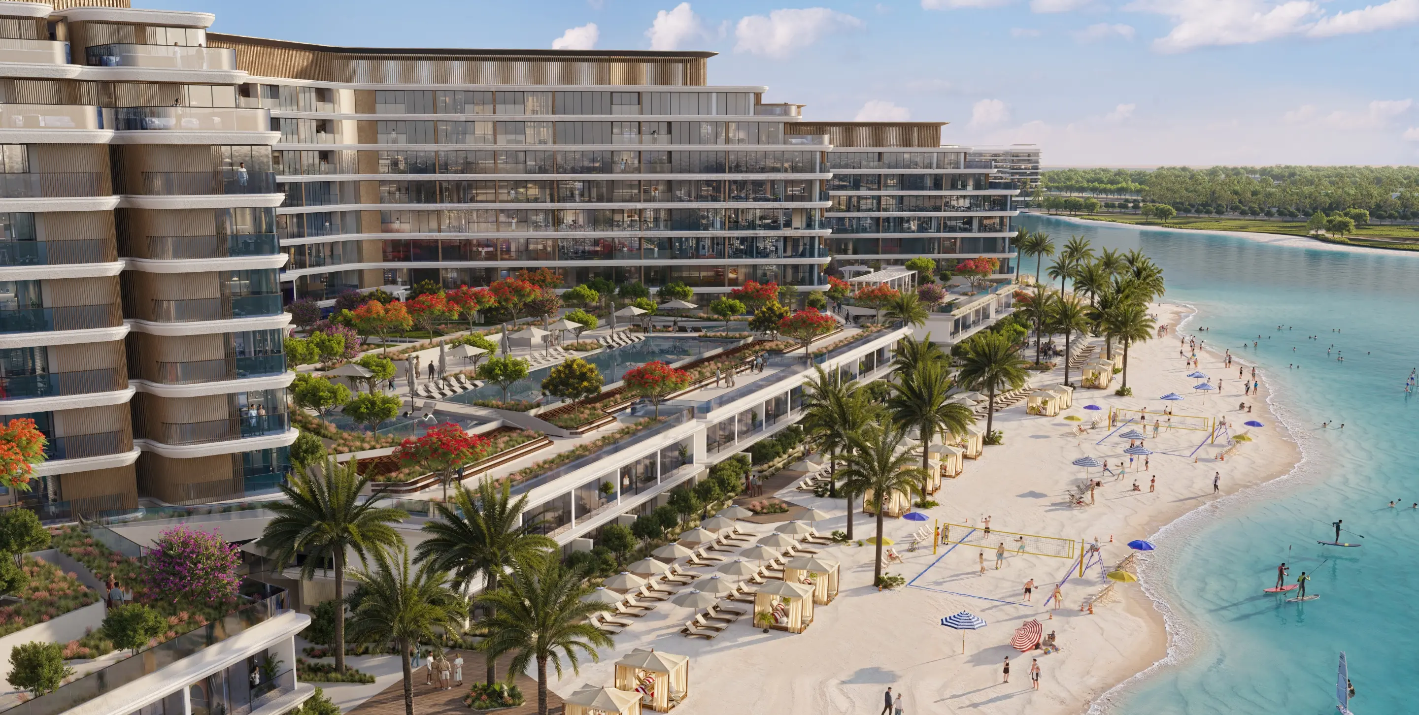 Sobha's render of a beach-residences block from above, with pool decks and planted terraces stepping down to a beach with volleyball nets