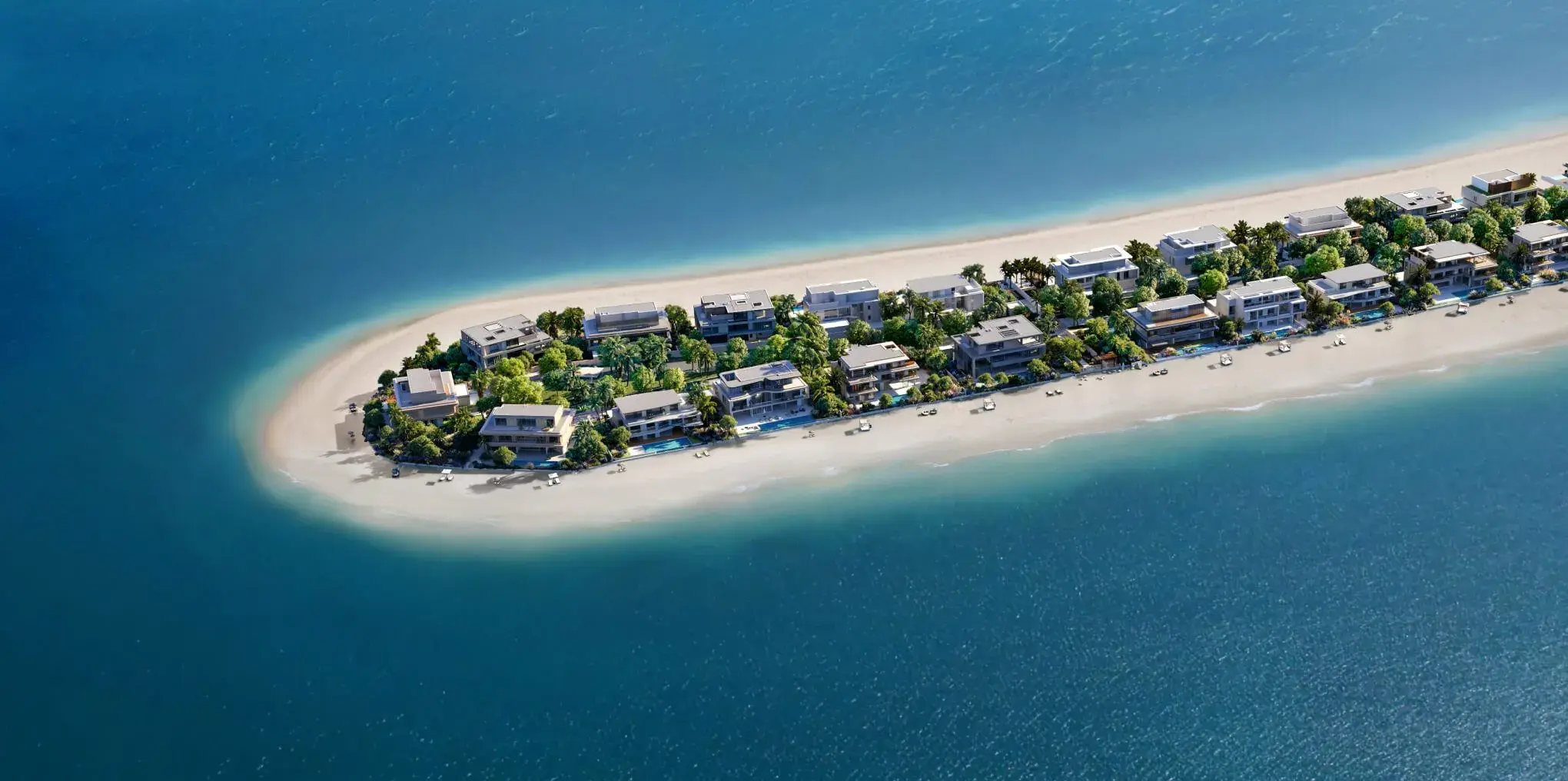 Aerial view of a small, narrow island with buildings and beaches.