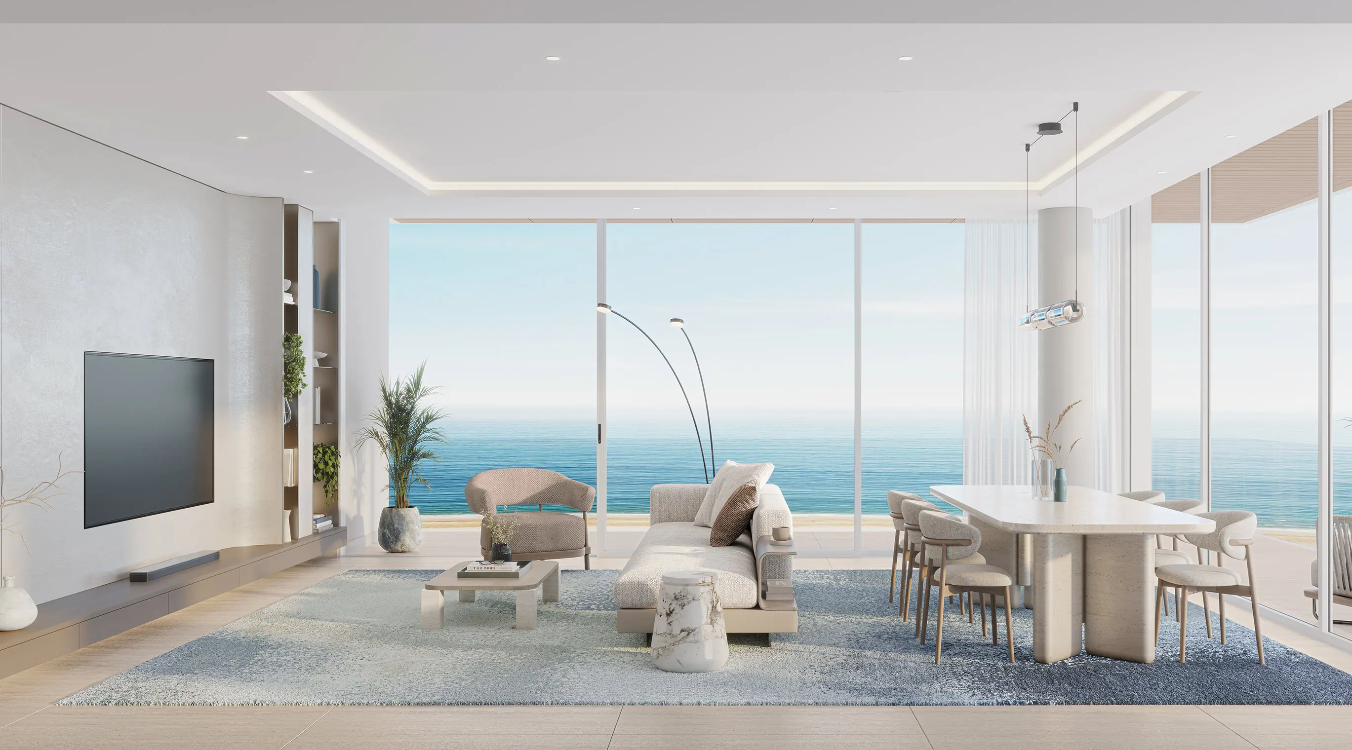 Living and dining room with full-height windows facing the sea