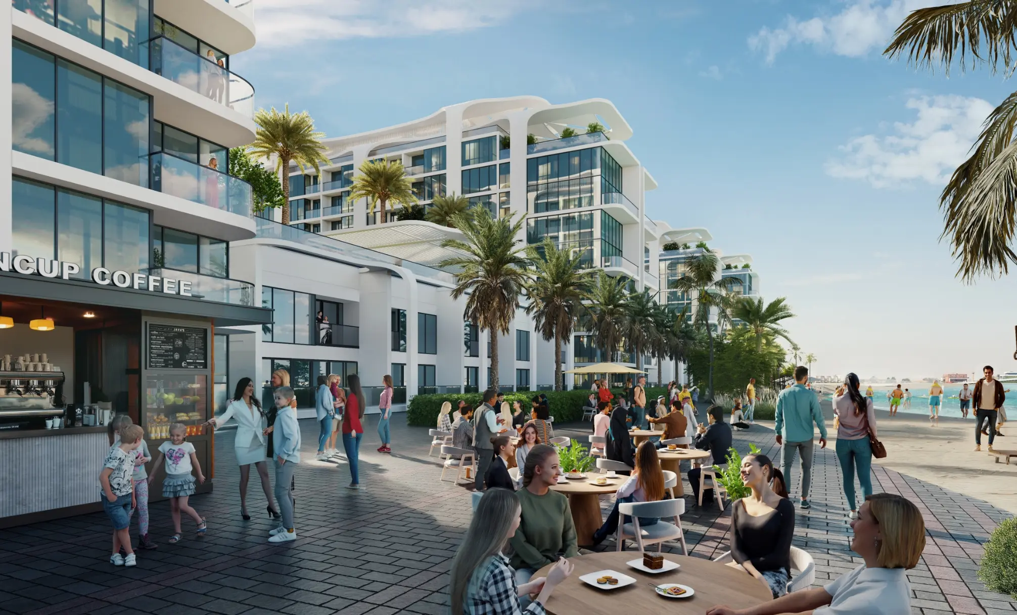 Render of a beach promenade with a coffee kiosk and café tables below white apartment towers, with people walking towards the sea
