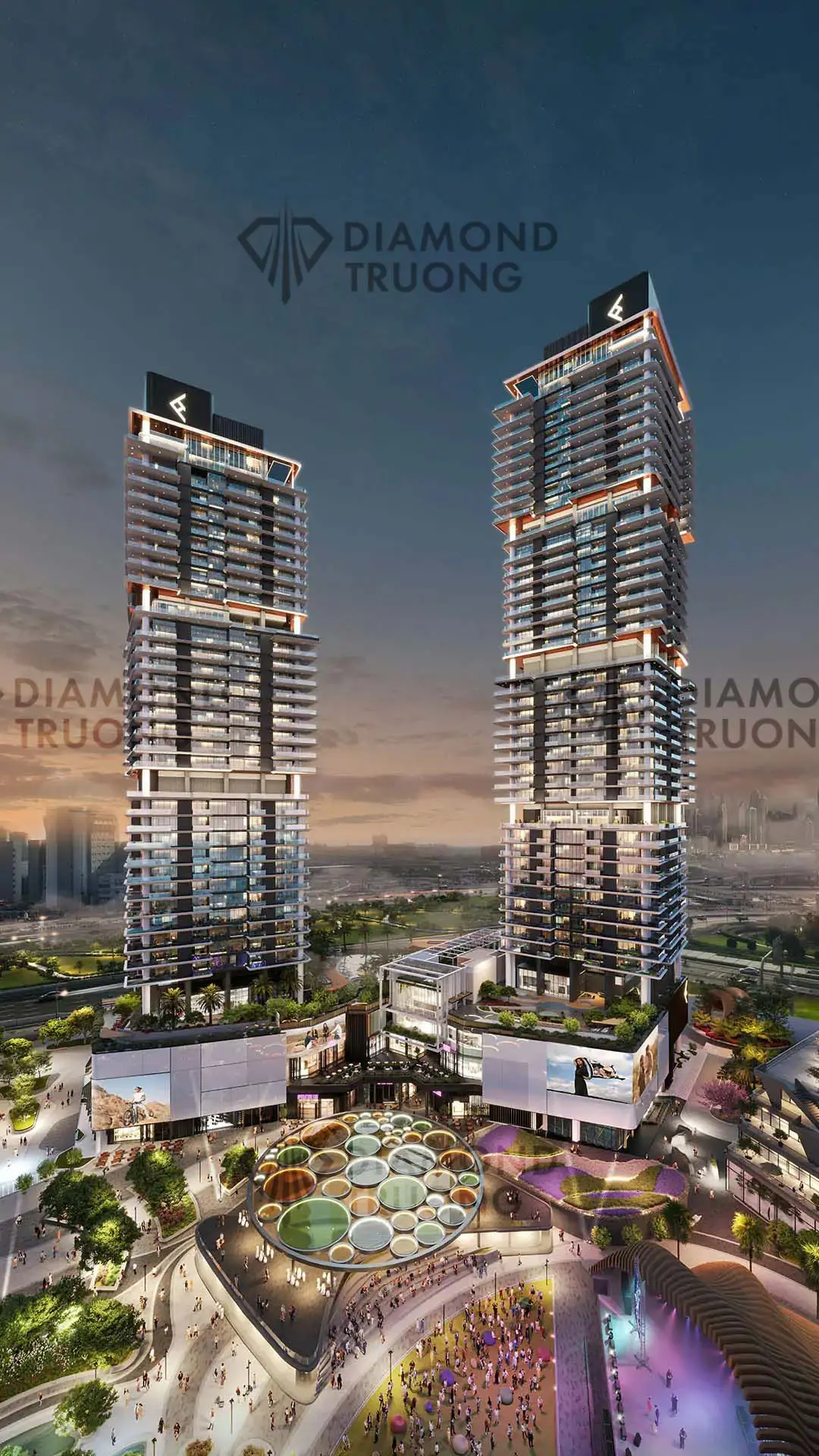 Ellington's render of Mercer House's two towers at dusk, above a crowded plaza in Uptown Dubai