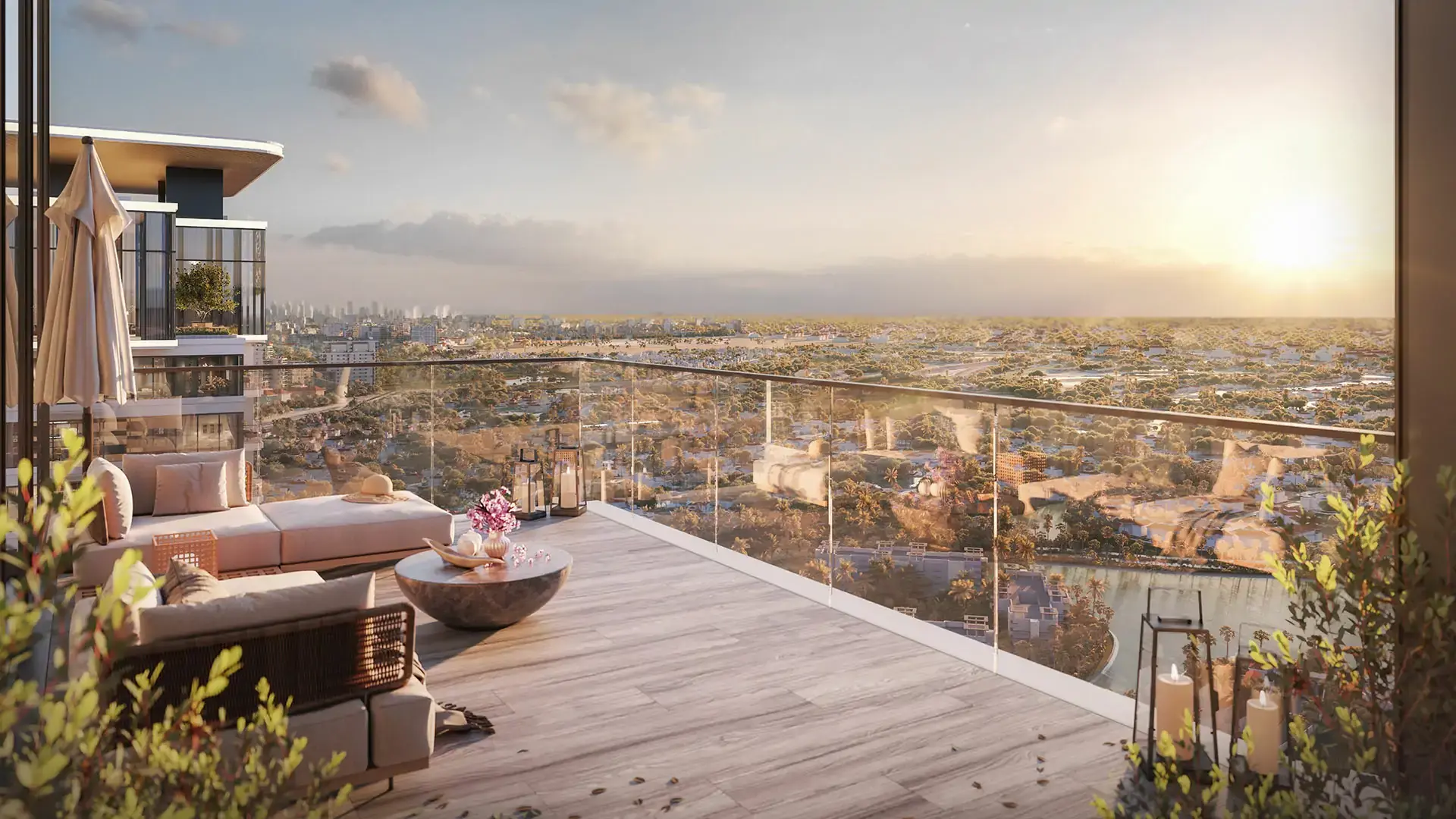 Ellington's render of a UH by Ellington terrace with sofas and lanterns, looking over villa communities and a lake at sunset