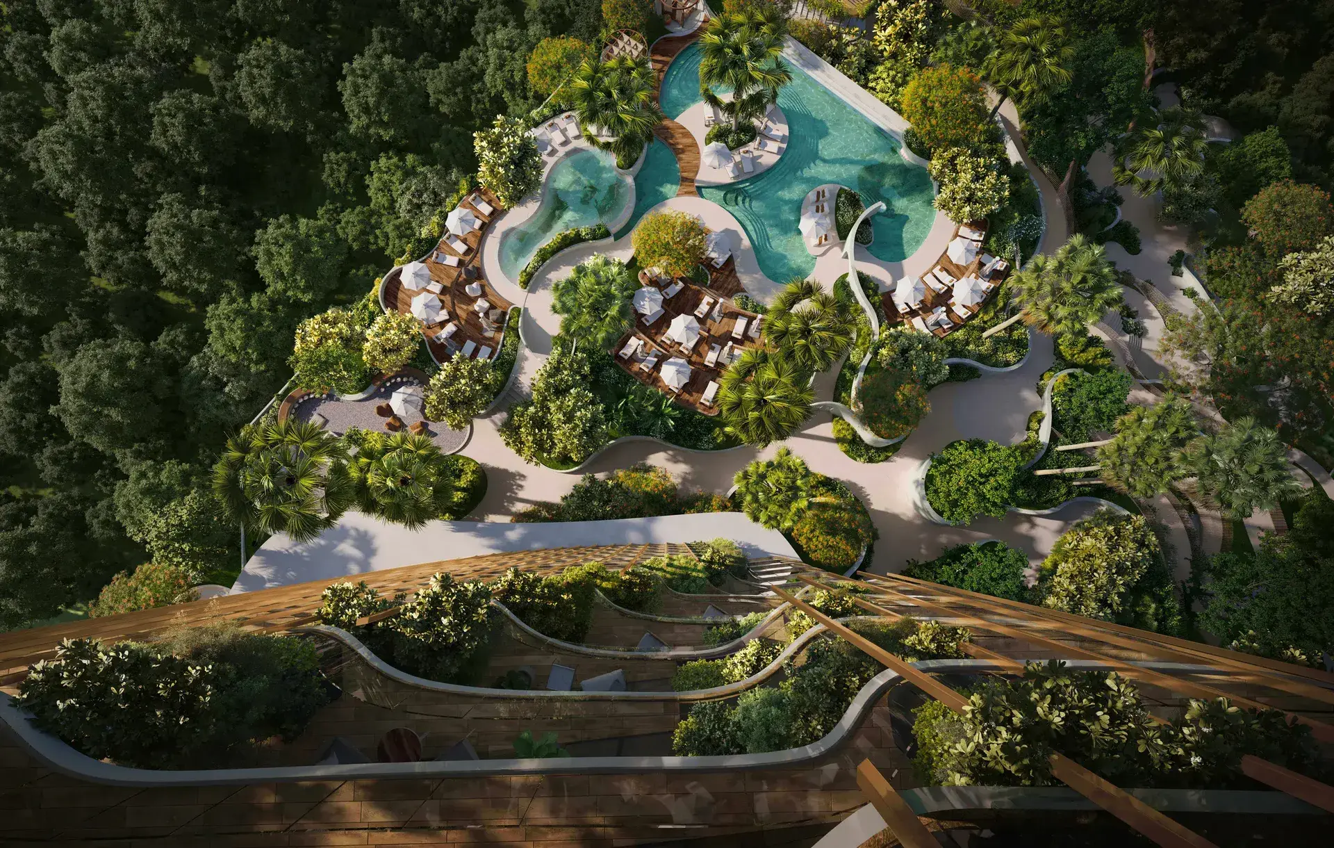 Aerial render of lagoon-style pools, loungers and decks among dense trees, seen from a planted terrace