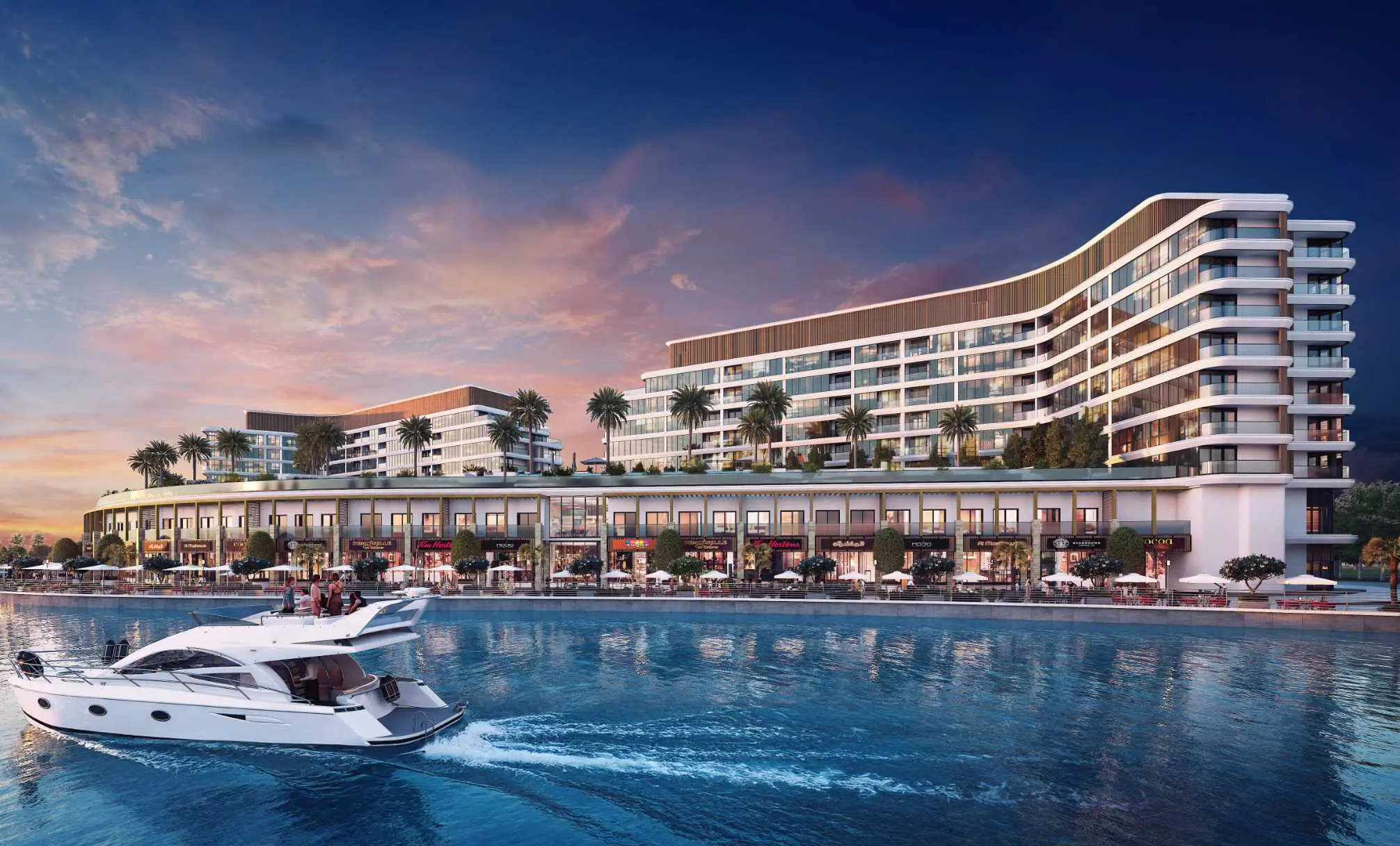 Render at sunset of the same blocks from the water, with the shopfronts below lit up and a motor yacht in the foreground