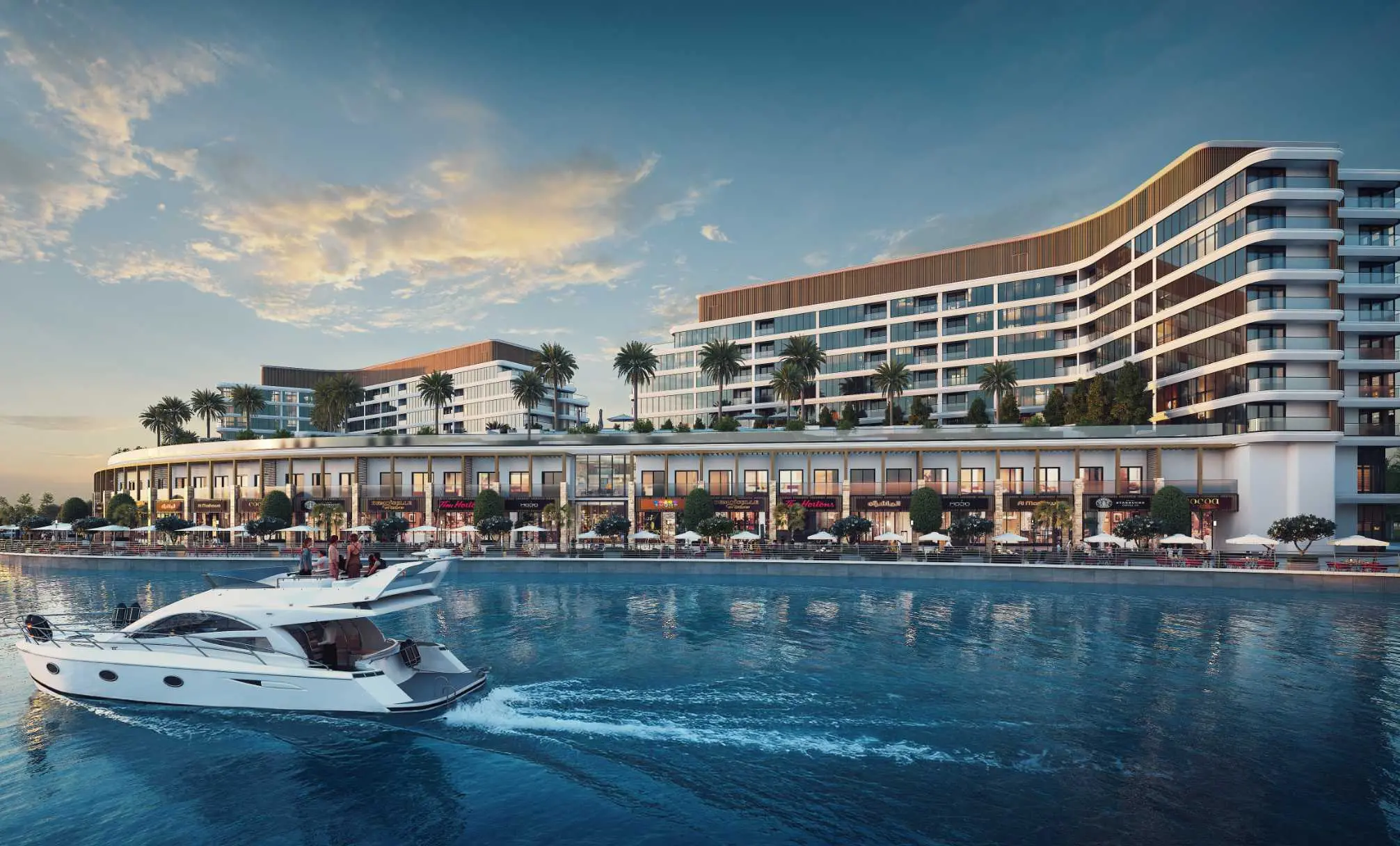 Render at dusk of Pearlside's curved mid-rise block above a waterfront arcade of shops and cafés, with a motor yacht crossing the canal