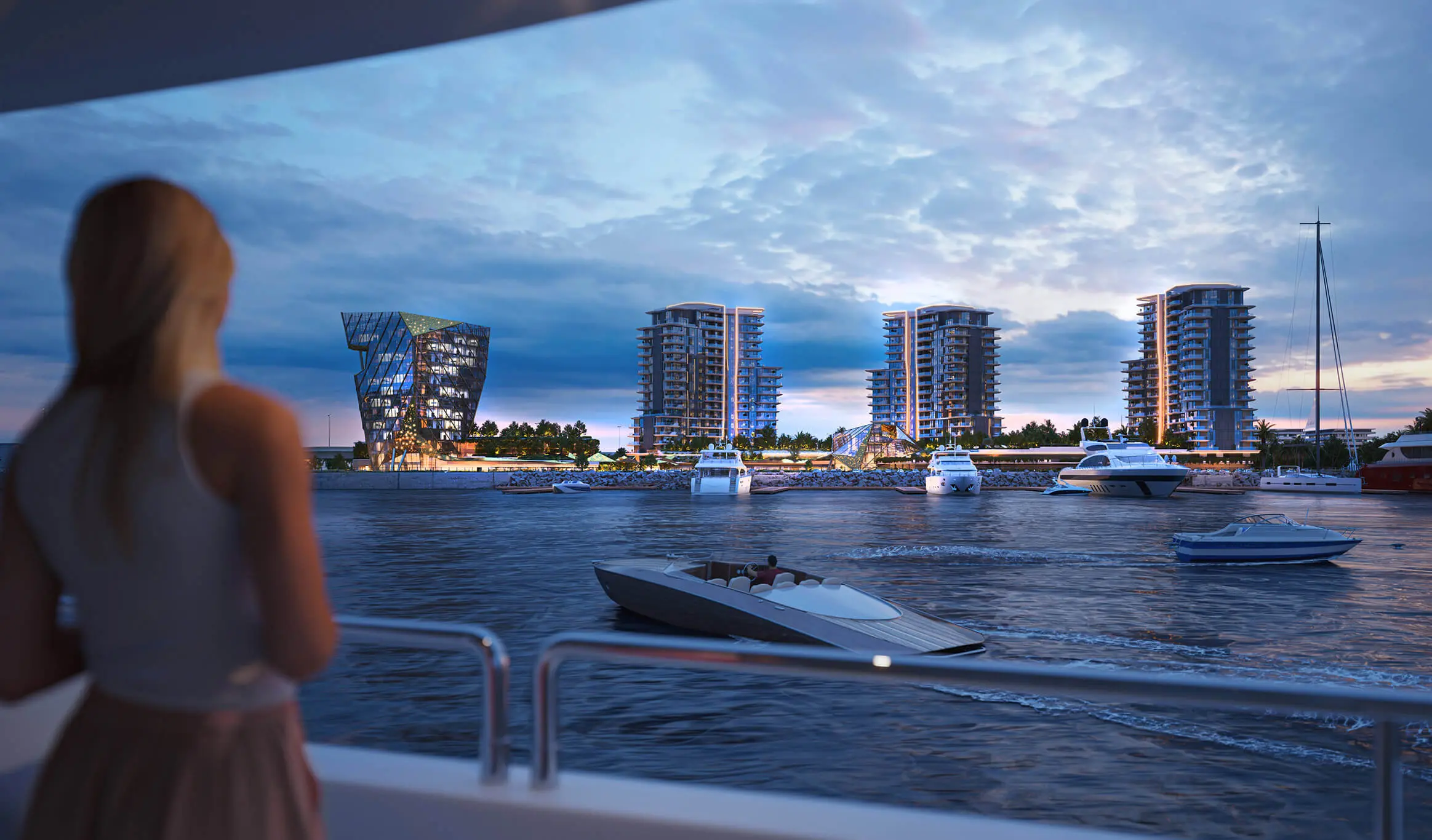Render of Portside Square's three residential towers and glass office tower across the water at dusk, seen from the deck of a boat