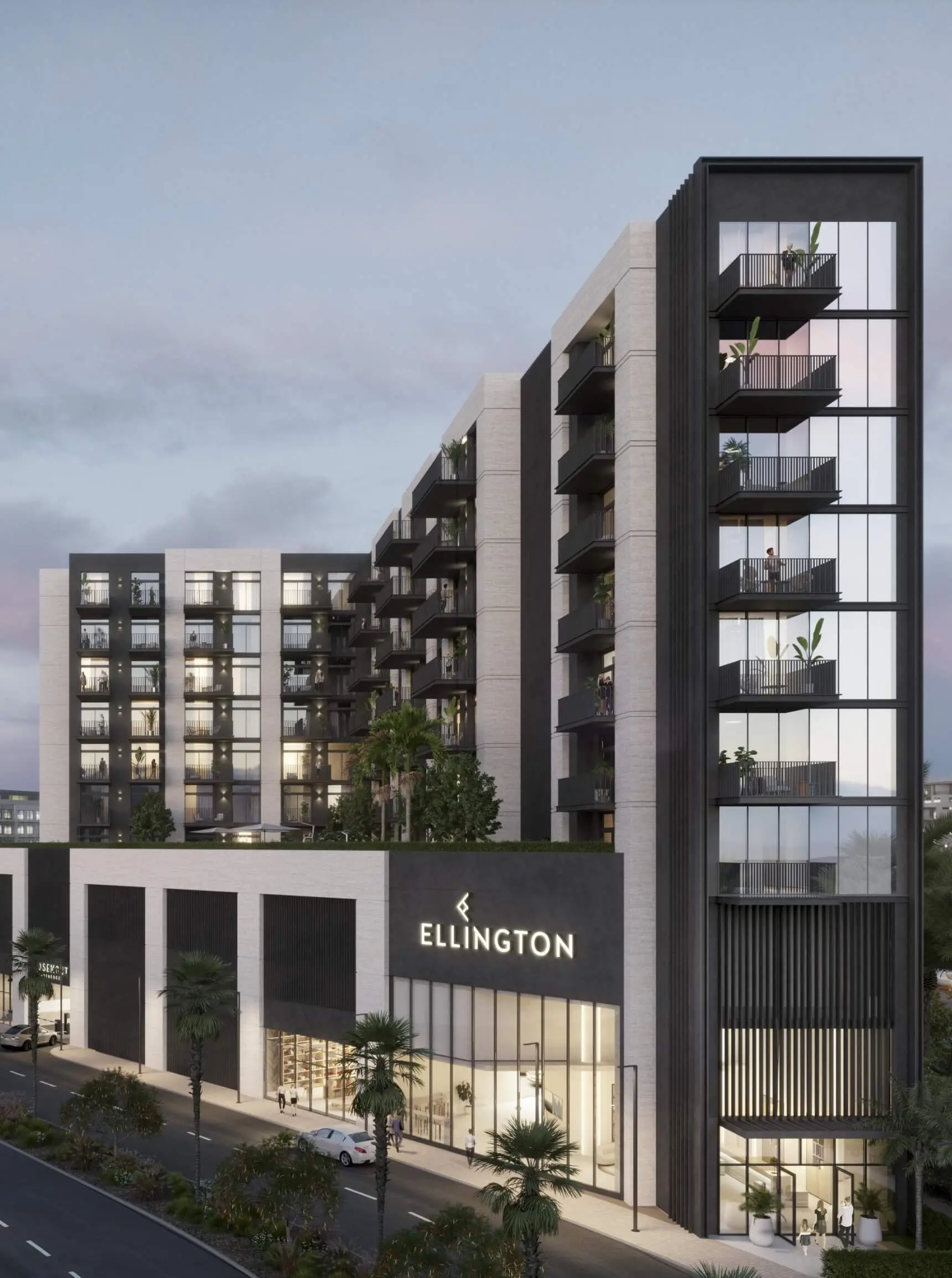 Render of Rosemont Residences from the street at dusk, with a glazed corner of balconies and the Ellington sign over the lobby