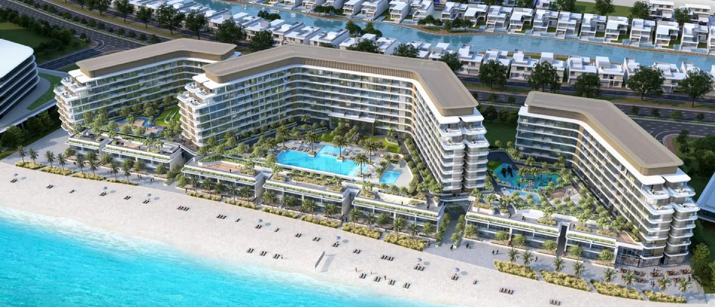 Aerial render of Selene: three mid-rise blocks around pool courtyards behind a low row of duplexes on the beach, with villas and a canal behind