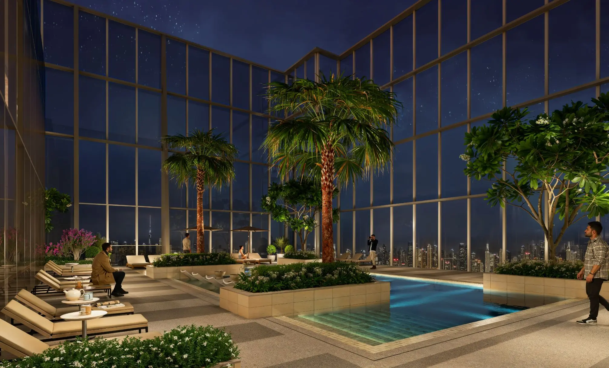 Night render of a pool deck with palms and loungers inside tall glass walls, the city lights beyond