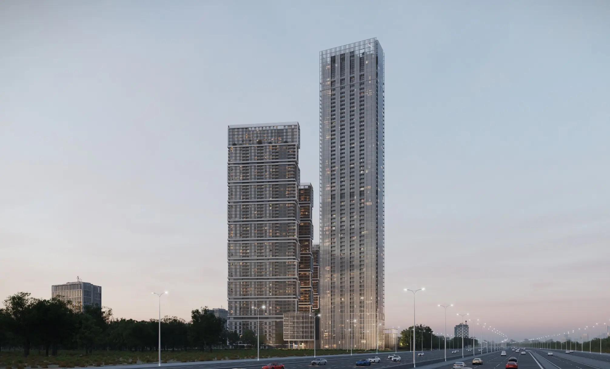 Dusk render from Ras Al Khor Road of a slender glass tower beside a stepped tower, with traffic on the highway in front