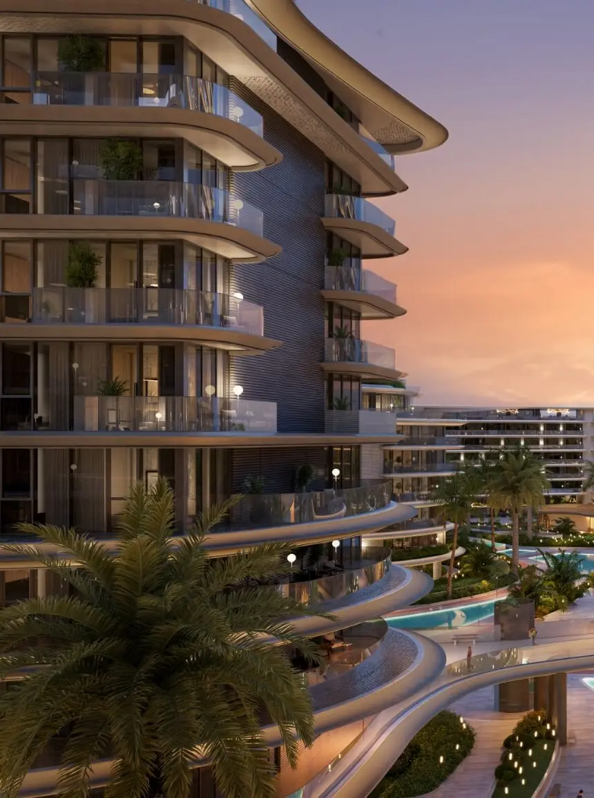 Render of a building with curved balconies at dusk, its terraces stepping down to pools and palms