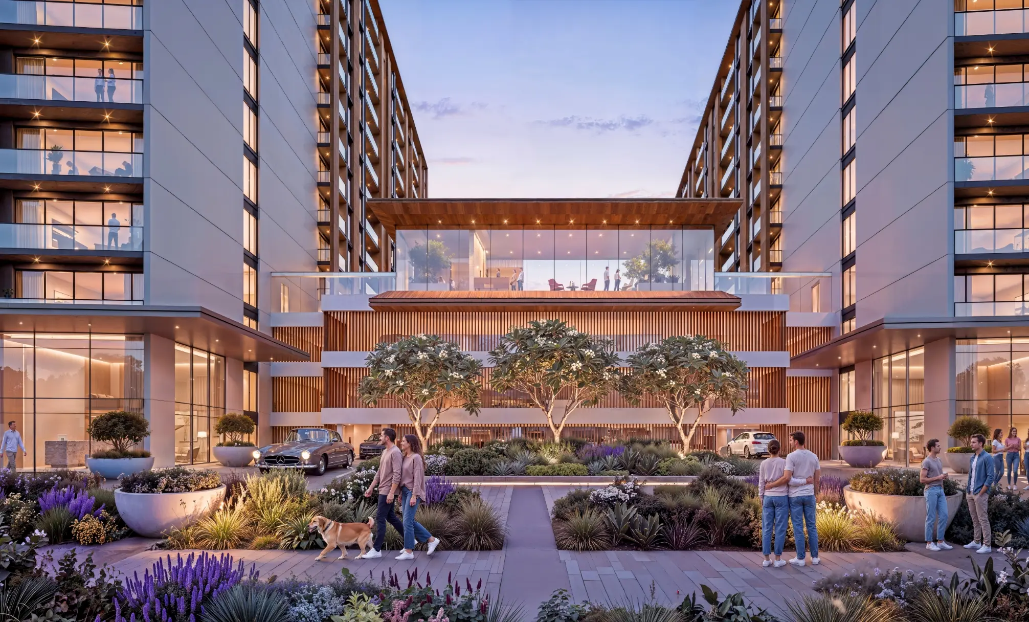 Render at dusk of a planted entrance court between two apartment blocks, with a glazed pavilion on the podium above