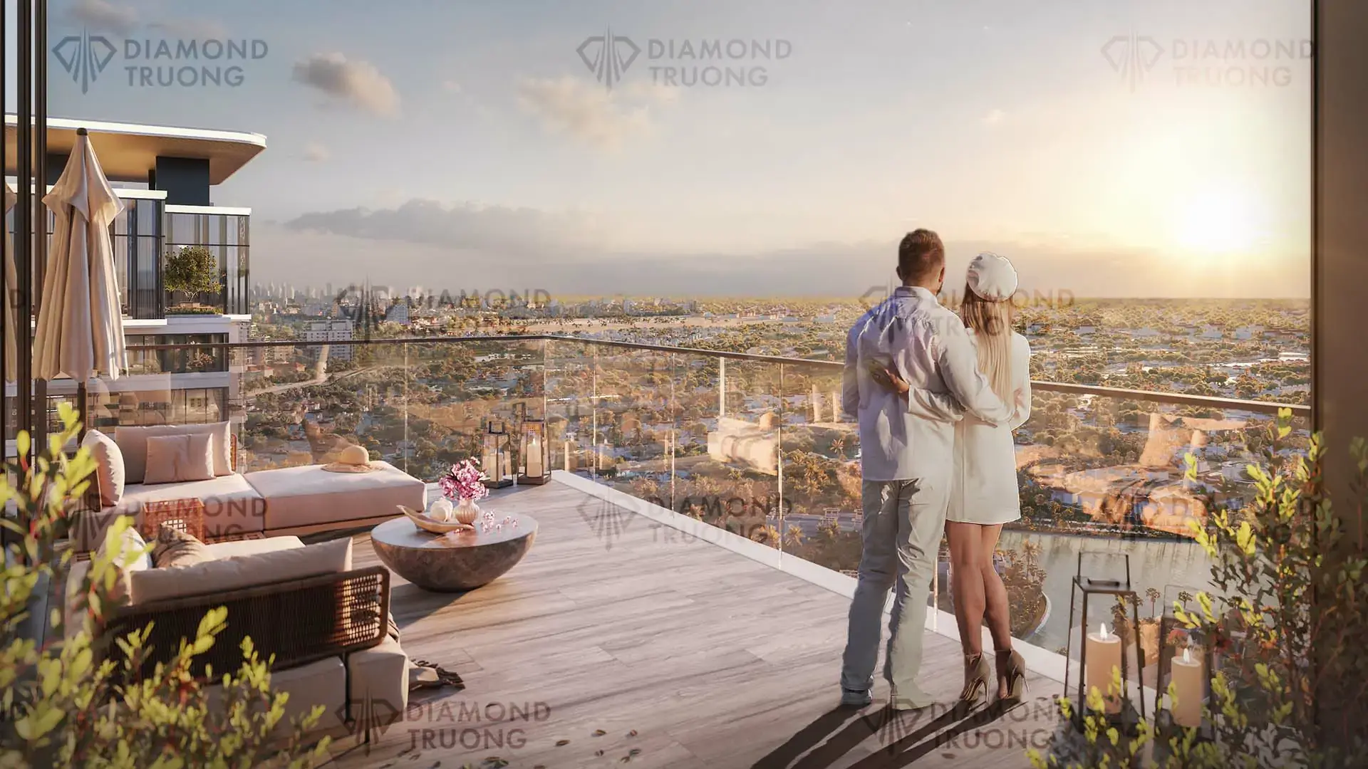 Couple on a balcony with an outdoor sofa, looking over trees and low-rise homes at sunset