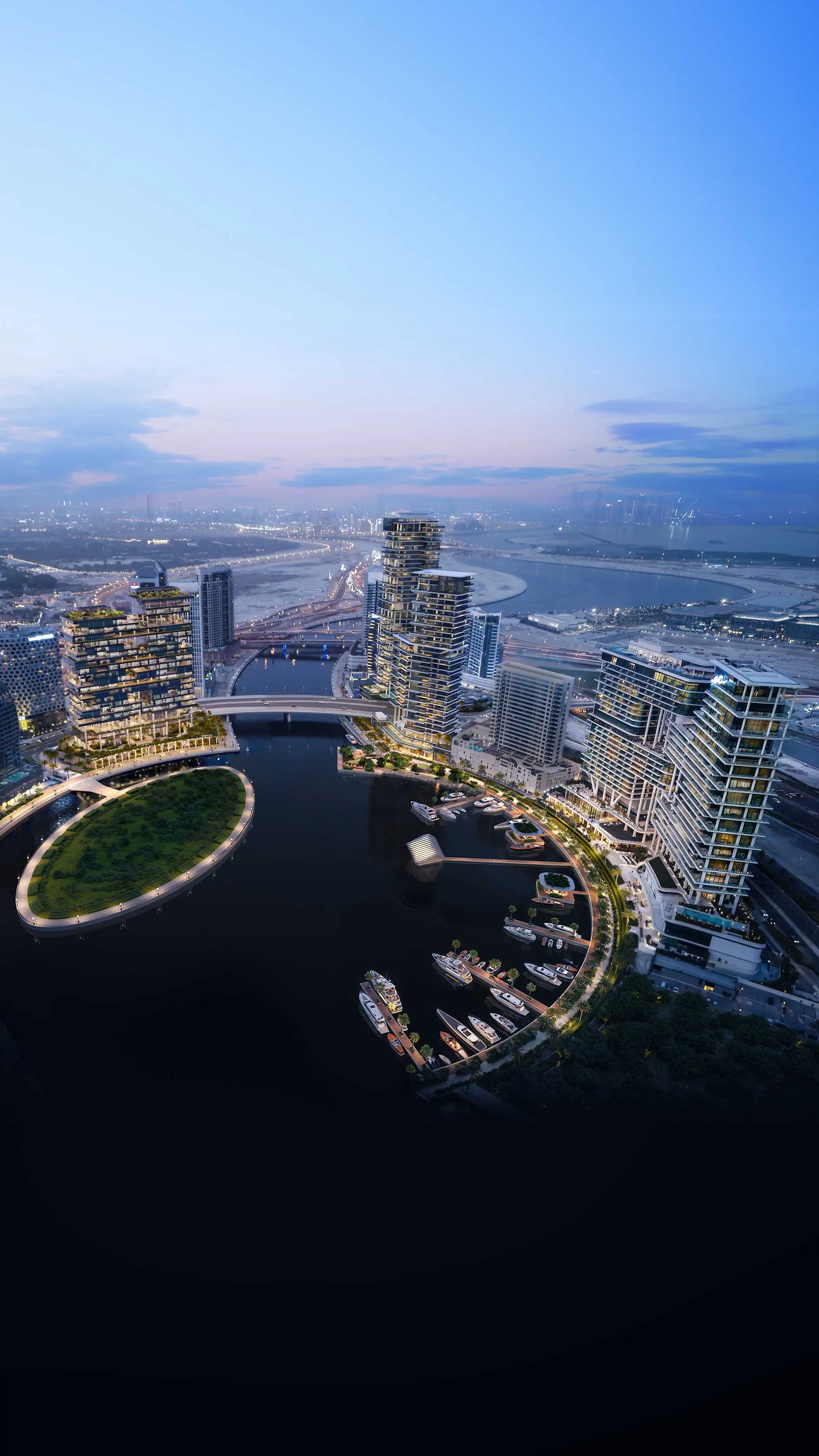 Aerial render of Marasi Bay at dusk, the oval island lit up and towers curving around the marina
