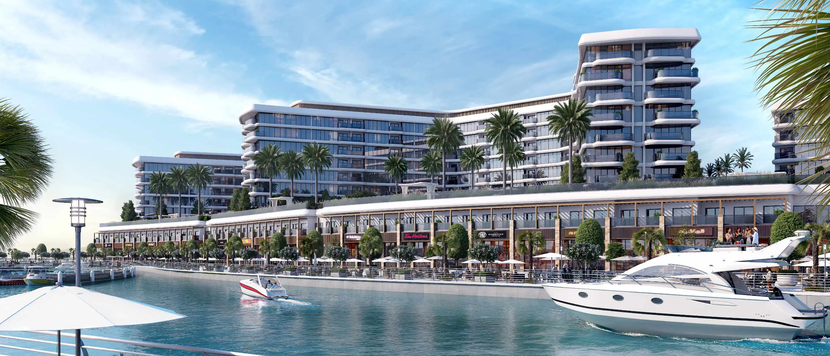 Render of mid-rise blocks above a waterfront arcade of shops, with a wing end of stacked curved balconies and a motor yacht passing