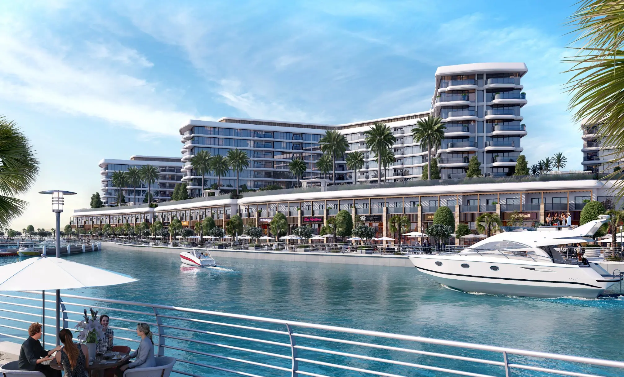 Render of diners at a railing across the canal as a motor yacht passes the arcade of shops below the blocks